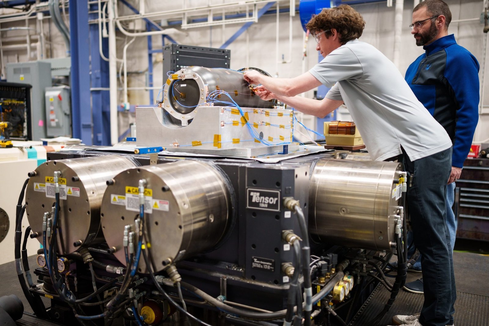 Engineers set an inert test article on a six-degree-of-freedom shaker table at Sandia National Laboratories